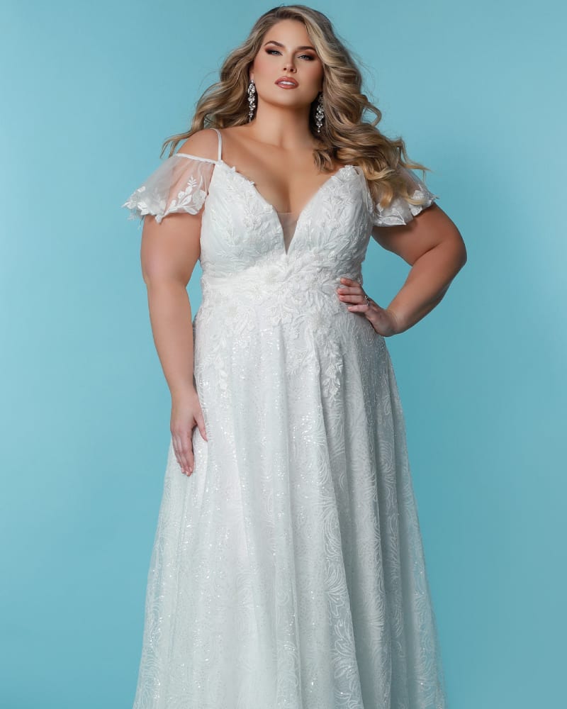 Front of a model wearing a size 28 Lizzy Wedding Dress in Ivory by Sydney's Closet. | dia_product_style_image_id:286674